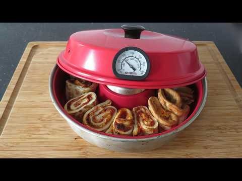 3 rolled frozen pizza in the Omnia Stovetop oven