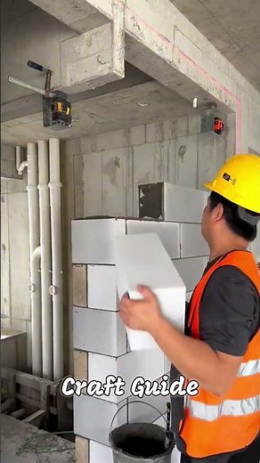 Building a wall with a brick laying tool