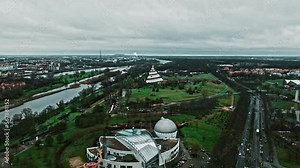 Aerial viewof Millennium Tower (Jahrtausendturm) in Elbauen park near Elbe river, Magdeburg city . Cone-shaped structure with a viewing platform & exterior ramp plus science & technology exhibits.