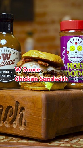 W Sauce Chicken Sandwich. The link to the full how-to video on MeatChurch YouTube is in the comments. Ingredients: • 8 boneless, skinless chicken thighs • 12oz bottle of @The W Sauce • 8 slices of pepper jack cheese • 8 toasted buns • 8 slices of lettuce, tomatoes and pieces of fried bacon and condiment of choice Cook: • Trim any excess fat away from the chicken. Place the chicken and 1 bottle of W Sauce in a vacuum sealed or ziplock bag. • Marinate for 12 - 24 hours. • Season with Meat Church H