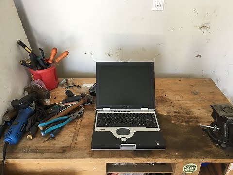 Scrapping a laptop for gold, silver, copper, and other metals.