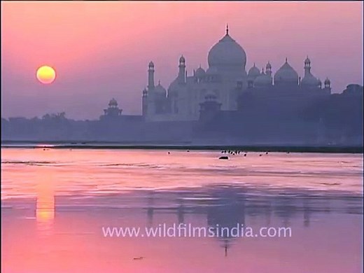 Sunrise view of the Taj Mahal overlooking the Yamuna River