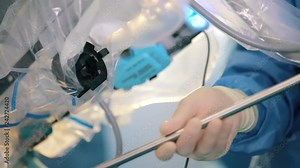 Surgical room in hospital with robotic technology equipment, machine arm surgeon in futuristic operation room. Minimal invasive surgical inoovation, medical robot surgery 3D view camera