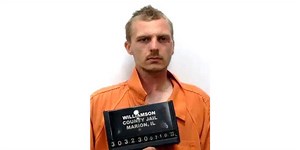 Man accused of resisting arrest while holding shovel