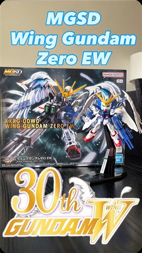30 YEARS OF GUNDAM WING: STILL SLAPPING HARDER THAN A BUSTER RIFLE! Behold the MGSD Wing Zero EW – a pint-sized powerhouse celebrating three decades of beautiful chaos, brooding pilots, and overdramatic explosions in space. 🚀 Features? Oh, buckle up: • Super Deformed, Super Deadly: It’s small, it’s cute, but it can still vaporize a colony with one pull of that twin buster trigger. • Articulation for Days: This SD can pull off more dynamic poses than Heero Yuy’s emotional range. • Wings of Light