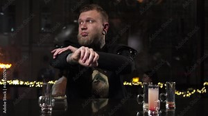 Portrait Biker young blond male drunk waiting for an alcoholic drink