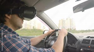 Men driver driving a car rides around the city in the helmet of virtual reality. 360 VR Technology.