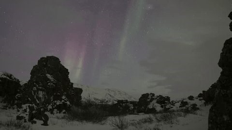 clip-4034723957-aurora-borealis-deep-starry-sky-through-clouds