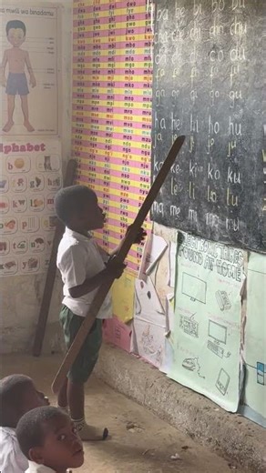 Children practice reading the syllabary in Zanzibar, Tanzania