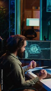 Vertical video Programmer being asked existential questions by awaken AI gaining consciousness, emulating humans, becoming self aware. Developer speaking with artificial intelligence on PC, camera B