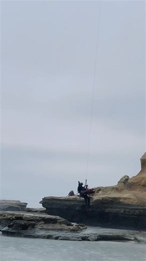 Shortly after 7:30 this morning, San Diego Lifeguards, San Diego Fire-Rescue crews, paramedics, and California State Lifeguards responded to reports of a hiker who had fallen and possibly suffered a hip fracture on the rocks near Flat Rock at Black's Beach. Crews located the patient, who was treated on scene, hoisted from the beach by Copter 3 to safety, and transported by medics to a local hospital for further care. Communication, training and teamwork across agencies helped get this patient sa