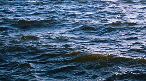 Slow motion sea waves. Close up of ocean waves. Blue water motion.