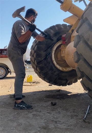 Caterpillar Tire Removal: 980c Loader Repair Process