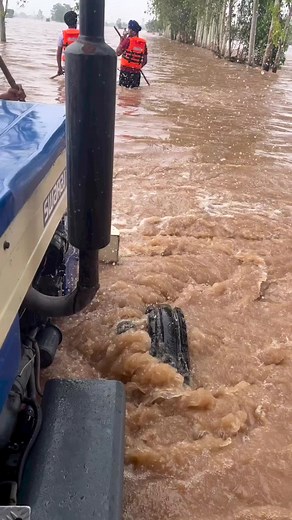 Rural Flood Rescue Efforts in Knee-Deep Water