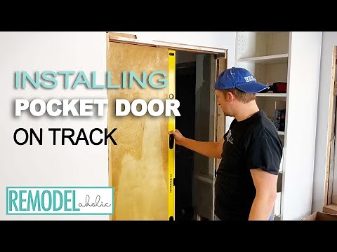 Installing a Pocket Door on the Track | Remodelaholic #diy #doors #doorframe