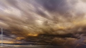 Light rain clouds in the bright summer night reflecting the midnight sun and create rainbow. 4K Time Lapse.
