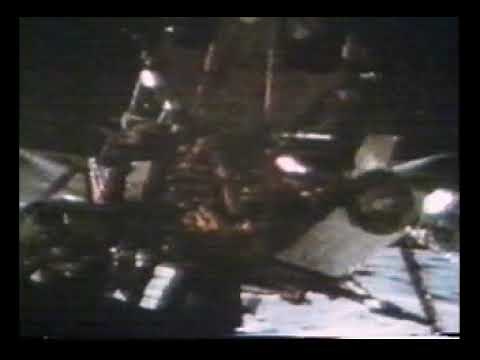 Apollo 15 astronauts David Scott and James Irwin deploy the Lunar Rover on the Moon, 1971.