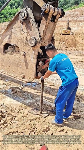 Leveraging Weight: Service Tech Uses Hydraulic Breaker Gravity To Loosen Tight Fasteners