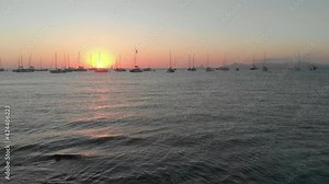 Drone flying backwards over the mediterranean sea in Formentera
