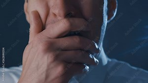Close-up of a frightened businessman screaming with fear. Horror scene