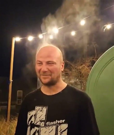 Steam Rises from Man's Head While Body Heat Evaporates in Cold Weather