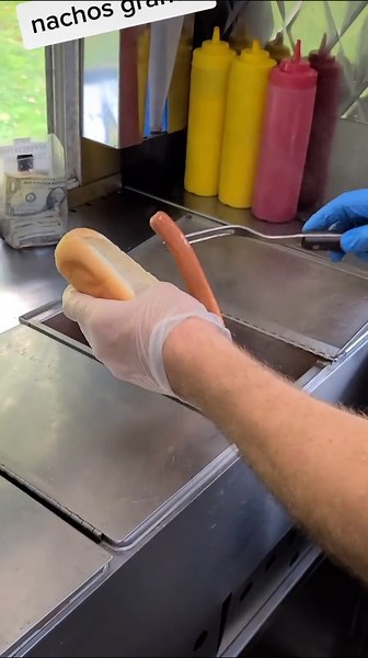 Delicious Nachos Grande Special with Guacamole and Hot Dogs