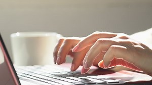 Woman freelancer working on laptop at home-office. Close up of female hands. Businesswoman writing business letter at work. Typing on keyboard