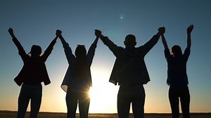 Teamwork of people raising their hands to sky, family business team concept. Group of people holding hands raise their hands to sky, prayer of man of woman. Business people, partners, trust concept