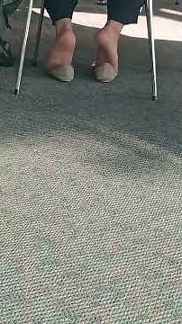 Asian lady shoeplay in the library