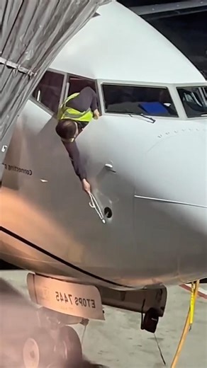 The Truth Behind Why This Mechanic Is Touching the Airplane in the Hangar