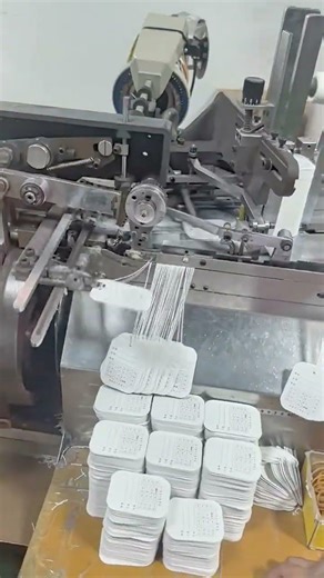 Machine Automatically Threads the Tag Cord and Ties the Knot