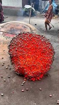 Traditional amulet is being crafted using tin and clay with primitive techniques exceptional skill.