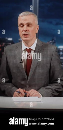 Professional Mature TV Presenter of National News Marathon Conducts Live Broadcast, Promptly Informing About International Events. Breaking News Screen Creates Atmosphere of Constant Updates. Vertical Stock Video Footage - Alamy
