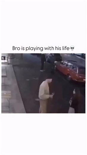 Sarcasm Daily on Instagram: "This video captures a dramatic and highly stylized confrontation between a man and a woman that unfolds across two different camera angles. It begins with grainy, outdoor security footage showing the pair arguing on a sidewalk near a parked car. As the tension escalates, the woman punches the man, and he reacts by falling to the ground in a theatrical manner. During this fall, digital overlays appear in the air—first a large engagement ring, and then a glowing yellow