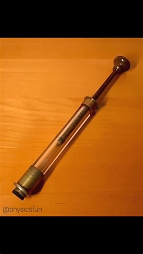 physicsfun on Instagram: "Antique Fire Syringe Demo: rapid adiabatic compression creates enough heat to ignite and incinerate a small ball of cotton. This antique device has a cylinder of thick glass and a piston made of hard wood. The seal is accomplished with a thin gasket of oiled leather. The cotton ignition source is attached to the end of the piston with a loop of thin wire. Similar to the physics of how Diesel engines ignite fuel without a sparkplug. Adiabatic processes are those in which