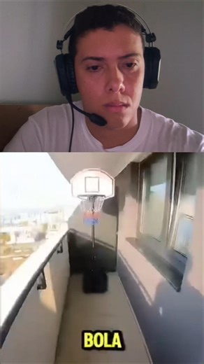 He plays basketball on top of the building.