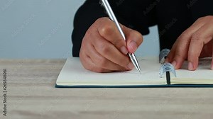 Adult student university study in class and hand note lecture in open notebook for exam. Adults education is practice in engage systematic, sustained self-educating activities in new knowledge skills