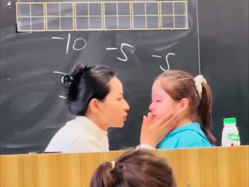 A Teacher Comforts A Crying Student