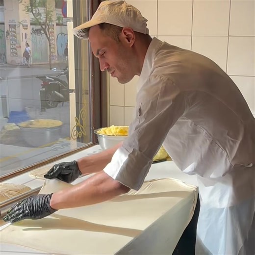 Bougatsa being made, wrapped and baked on the spot for us in the heart of Athens 🇬🇷🇦🇺❤️ Bougatsa - sweet or savoury 🤤 Sweet is filled with a semolina based custard, baked and topped with a dusting of icing sugar and sprinkle of ground cinnamon. Savoury - filled with Feta Cheese and Anthotiro. #amazing #skill #brilliant Creme Royale ❤️ www.iagtm.com.au | It's All Greek to Me