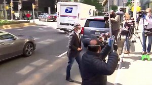 BREAKING Trump's former lawyer Michael Cohen, wearing a face mask, walks into his NYC apartment building after being released from federal prison. He was released due to coronavirus concerns and will serve the rest of his three-year sentence at home. yhoo.it/3bNjkcR | Yahoo News