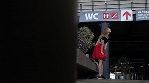 The girl really wants to go to the toilet and barely holds back