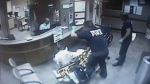 Video: Paramedic flips patient off stretcher