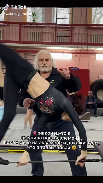 Acrobatic Maneuvers on Aerial Silk in Gym