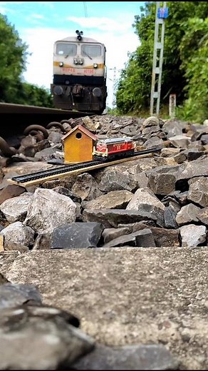 “Real Train Meets Miniature Railway Station | Extreme Close-Up Diorama Scene”