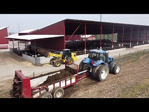 SPREADING MANURE OUT OF OUR MONOSLOPE BARNS