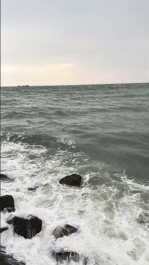 Powerful Waves Crashing on the Rocks 🌊