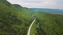 Drone shot of a stunning scenery of the famous Cabot Trail with a...