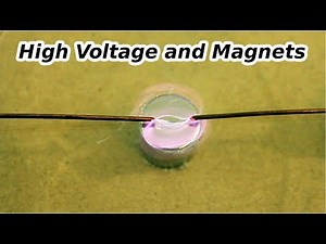 High Voltage AC and DC arcs in a Magnetic Field