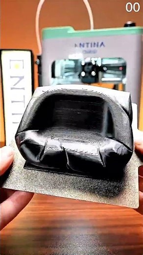 3d printer builds black lattice structure as layers stack with precision #shorts