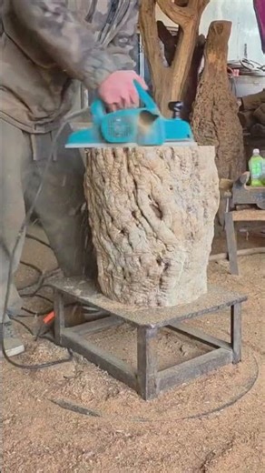 the process of smoothing wood with a tool
